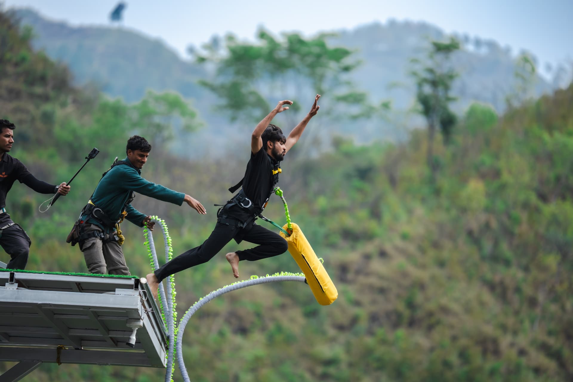 Jumper free falling from the 219 metre bungee platform over the Ganga gorge in Rishikesh